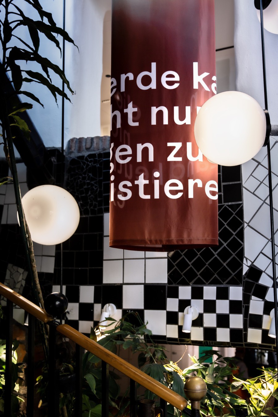 detail of a textile column with text fragment on it: scenography festival center of Klima Biennale Wien at KunstHausWien by JASCHA&FRANZ and Andrea Grill