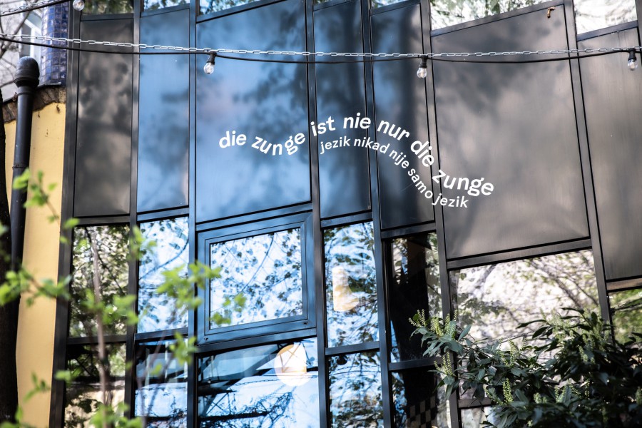 text fragment on a facade: scenography festival center of Klima Biennale Wien at KunstHausWien by JASCHA&FRANZ and Andrea Grill