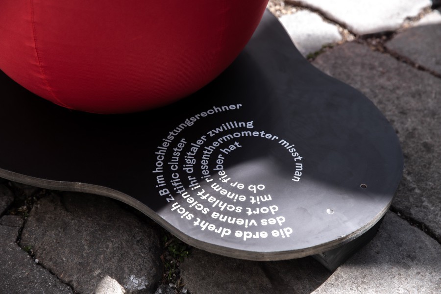 deatil of a printed text fragment by Andrea Grill on a seating module: scenography festival center of Klima Biennale Wien at KunstHausWien by JASCHA&FRANZ and Andrea Grill